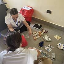 Volunteers preparing supply donation bags