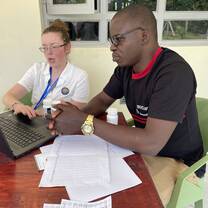 Volunteer instructing clinic director