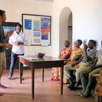 Community meeting discussing marine conservation initiatives in Mikindani