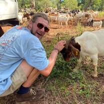 Volunteer with a goat