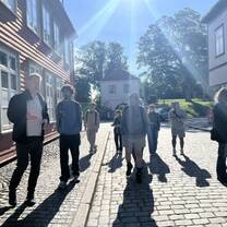 college students walking on a tour of the old town of Fredrikstad in the sunshine
