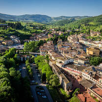 sun shines over the Italian town in Tuscany