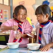 Two local children during a community workshop