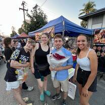 Group photo at a street food market 