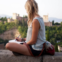 Woman overlooking the landscape in Granada, Spain