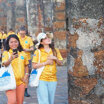 New teachers exploring the UNESCO-listed Sukhothai Historical Park ruins.