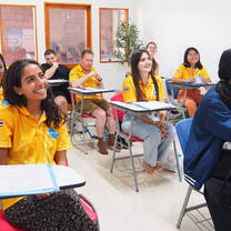 International summer interns attending an academic orientation workshop at the Kids English Thailand compound.