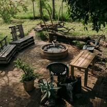 Fire pit with chairs in camp