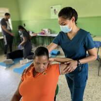 Nurse helping a Dominican Citizen