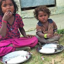 Mushar children enjoying school meal