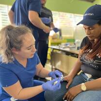Nurse helping a Dominican Citizen