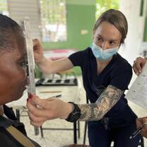 Nurse helping a Dominican Citizen