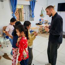 Students participating in interactive English learning activity inside classroom.
