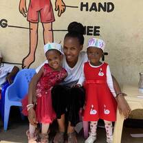 Teacher Elly with the children at our Christmas Party 