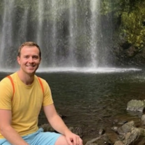 Intern enjoying the breeze of the famous water falls 