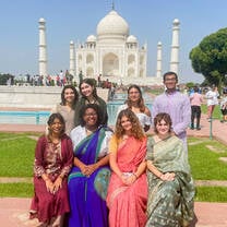 Students pose in front of the Taj Mahal.