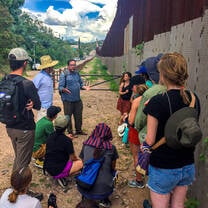 Students listening to professor on a site visit