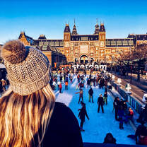 Woman observing an ice skating rink