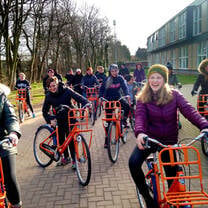 Students biking in Amsterdam