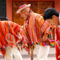Men in traditional clothing in Peru.