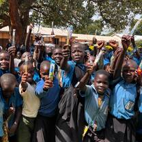 children showing their new tooth brushes