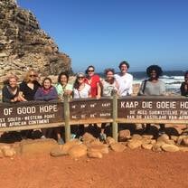 Students pose at Cape of Good Hope sign.