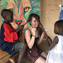 Teacher with students in Ghana