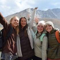 Four girls in front of a mountain