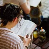 Student reading Bible