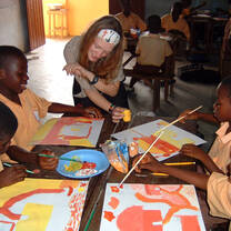 Teacher with students in Ghana