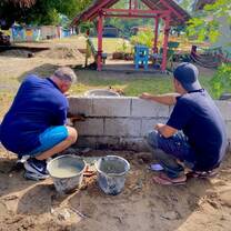 Volunteers building a wall 