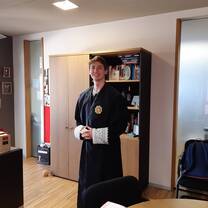 Student visiting court proceeding in judge's quarters (and trying on an official toga)! 