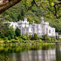 white castle on the edge of a lake
