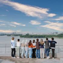 Students looking over the marina on the rooftop at the Malaysia campus