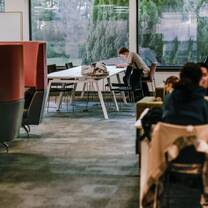 Students in the library, Edinburgh campus. View over the sunken lawn
