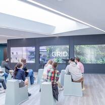 Class taking place in the showcase area in the GRID building, Edinburgh campus