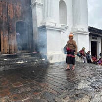 Maya woman outside the historic church of Chichicastenango during a cultural immersion experience in Guatemala