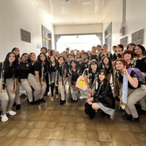 Group of students at a local Costa Rican high school pose for a photo with a Tico Lingo volunteer