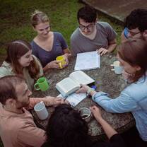 Volunteer assisting students during an English lesson at a local school in Heredia, Costa Rica.
