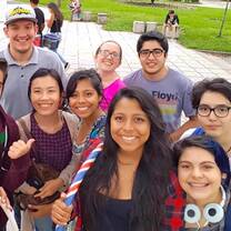 Costa Rican students pose for a photo with a Tico Lingo English-teaching volunteer