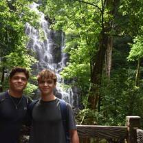Teens in front of a waterfall in Costa Rica