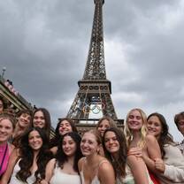 Teen travelers in front of the Eiffel Tower