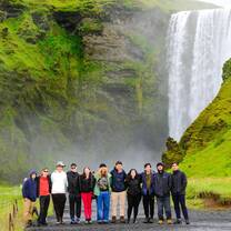 Teen travelers in front of a waterfall in Iceland
