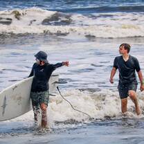 Teens surfing in Costa Rica