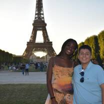 Teen boy and girl in front of the Eiffel Tower