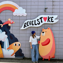 Women standing in front of wall art Revelstoke