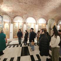 Students listening to a guided tour while at the Contrada Museum in Italy
