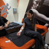 Sudent Sitting on Rehab Table