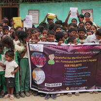 Volunteer teaching English and Mathematics to children at a community school in Morang, Nepal.