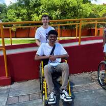 Two nomad participants in front of accessibility ramp